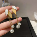 diamond bow pearl earring